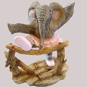 Tuskers Elephant In Pink Skirt Going Over Fence Nadia